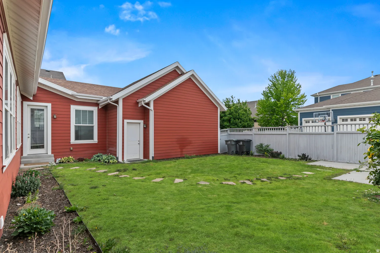 Manicured lawn area with stepping stones