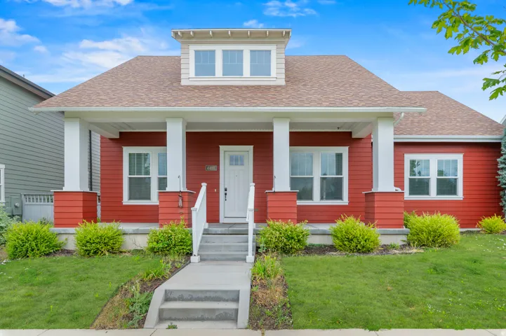 Red siding exterior with white trim details