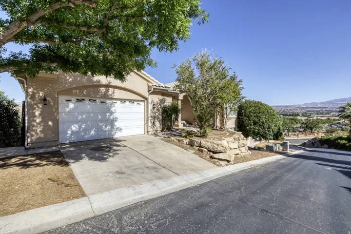 Stucco exterior residence with an attached two-car garage
