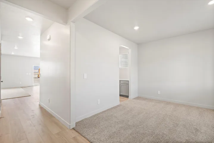 **DISLCAIMER** Interior package may vary. Open interior space featuring light wood-finish flooring and plush carpeting