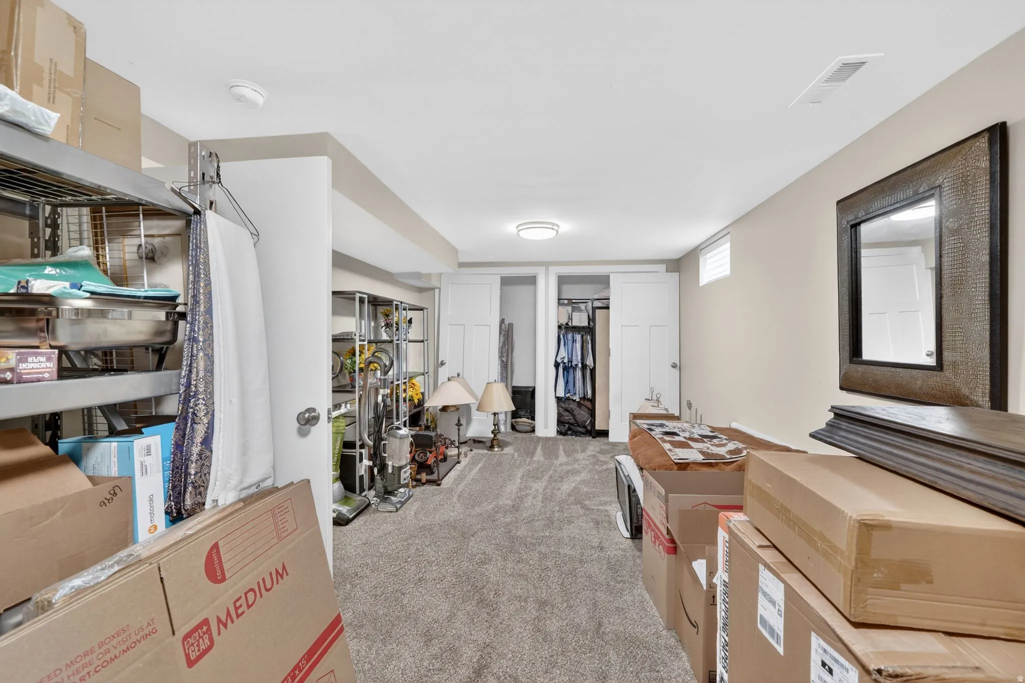 Carpeted room featuring neutral wall tones, recessed lighting, and white trim