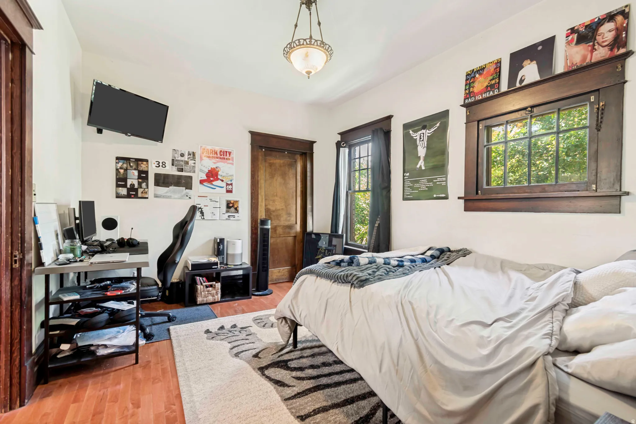 Warm wood-finish flooring complements the white walls