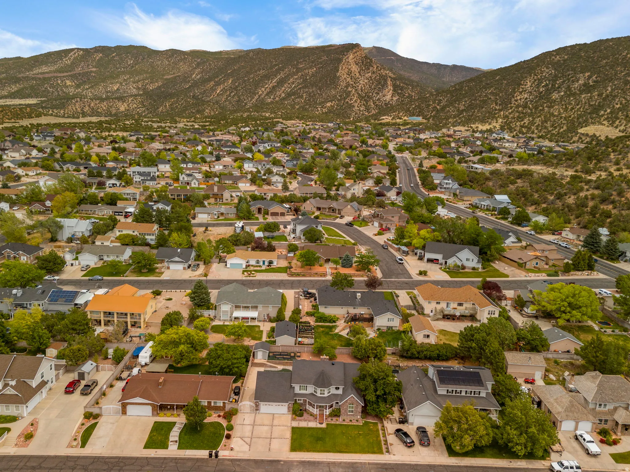 Residential neighborhood nestled against a mountain backdrop