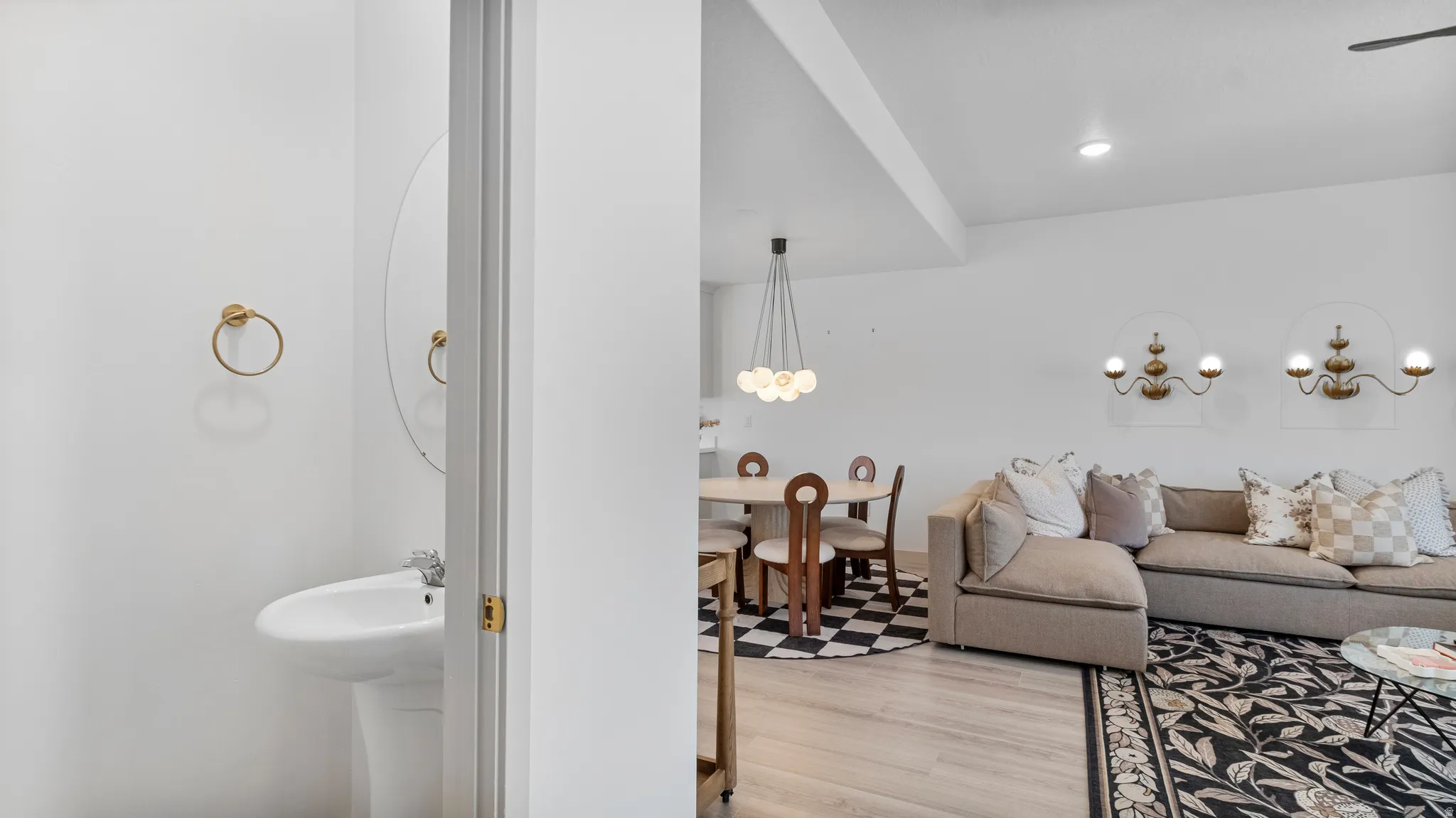 Bright interior featuring light wood-finish flooring and white walls throughout