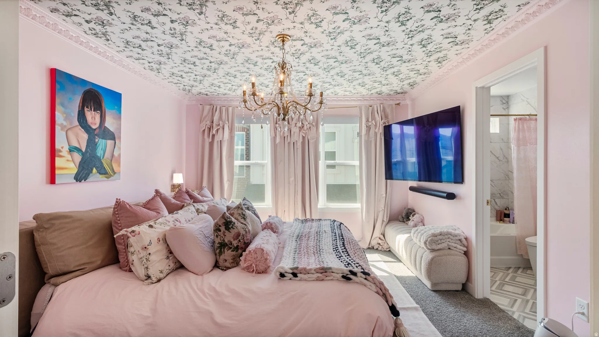 Bedroom featuring a decorative ceiling treatment, crown molding, and two windows with drapery