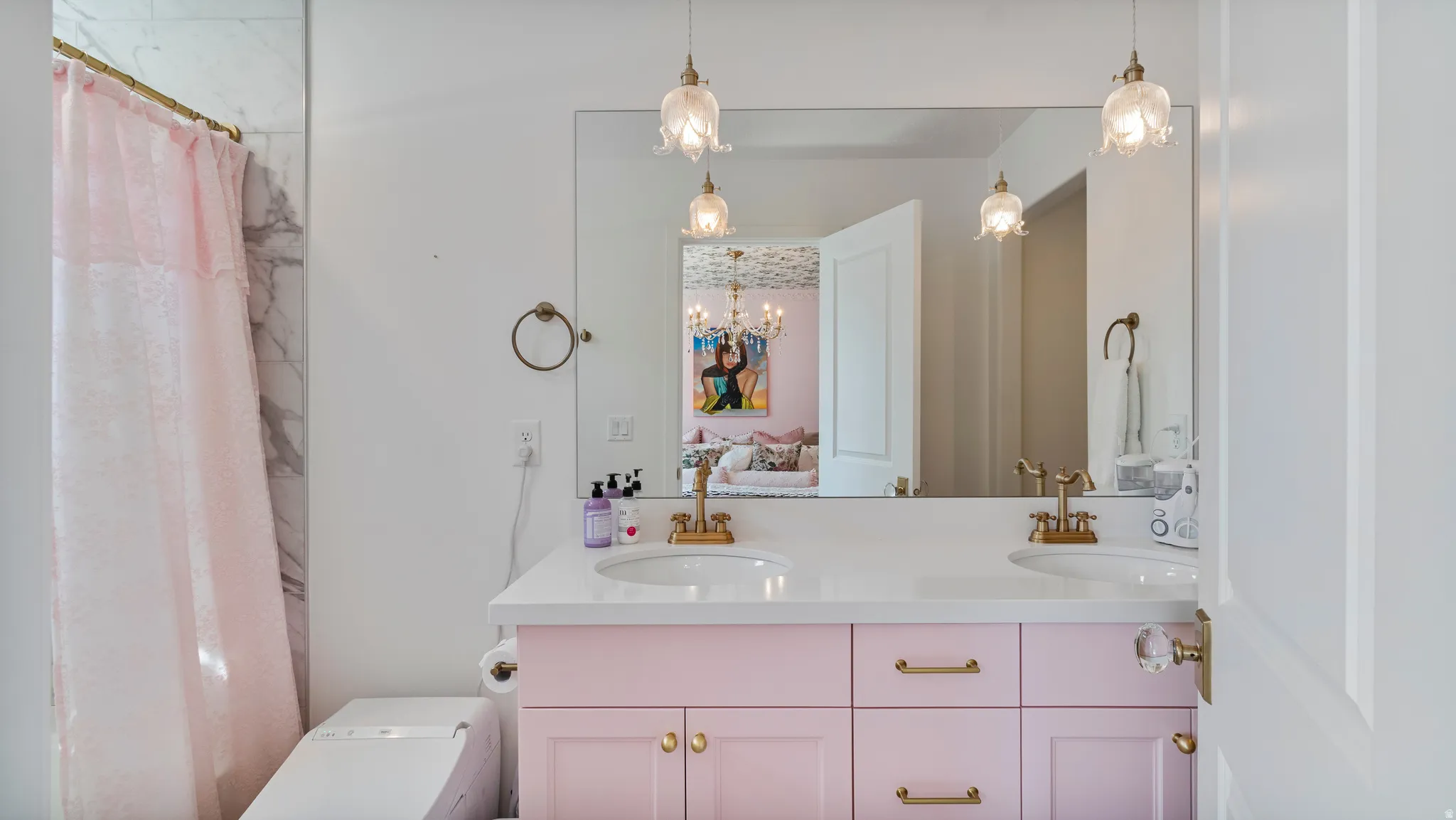 Double vanity with a white countertop and two undermount sinks