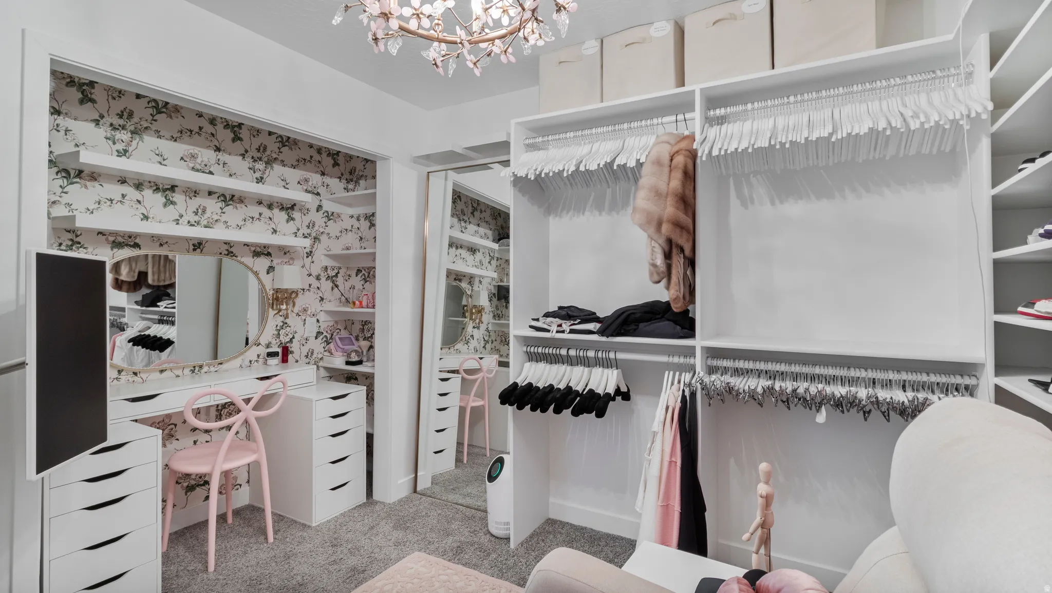 Custom closet system featuring extensive shelving and hanging storage