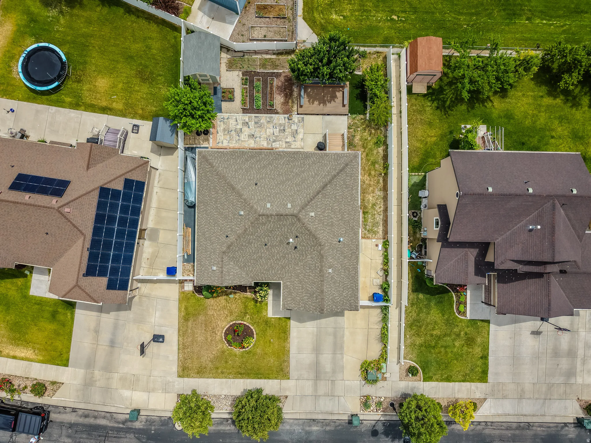 Single-story property featuring a gabled roof and a paved driveway