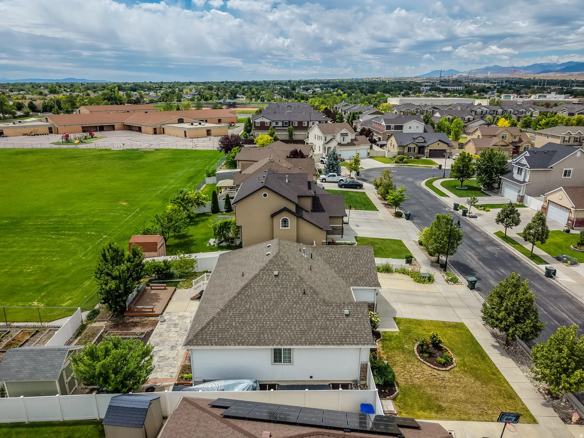 Aerial perspective showcasing a residential neighborhood with varied home styles and mature landscaping