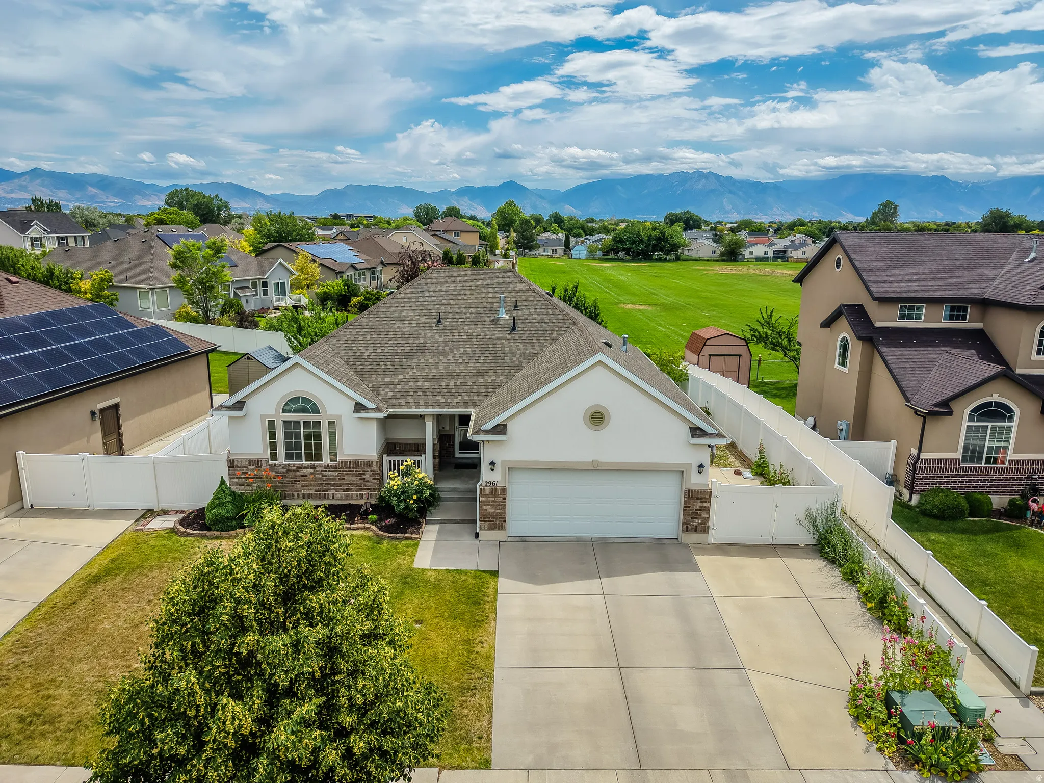 Single-story residence featuring a two-car garage and a paved driveway
