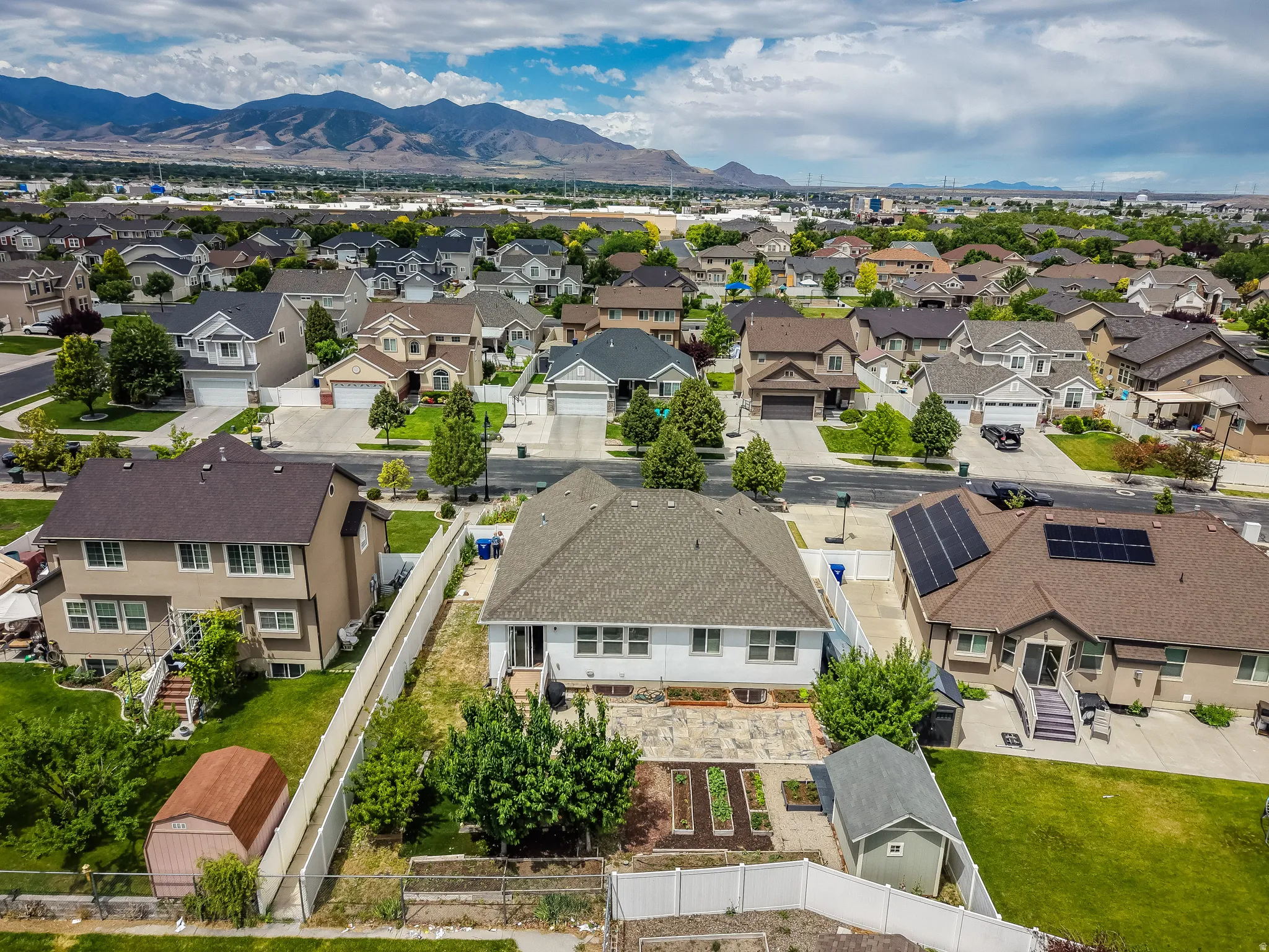 Aerial view of a residential neighborhood with distant mountains