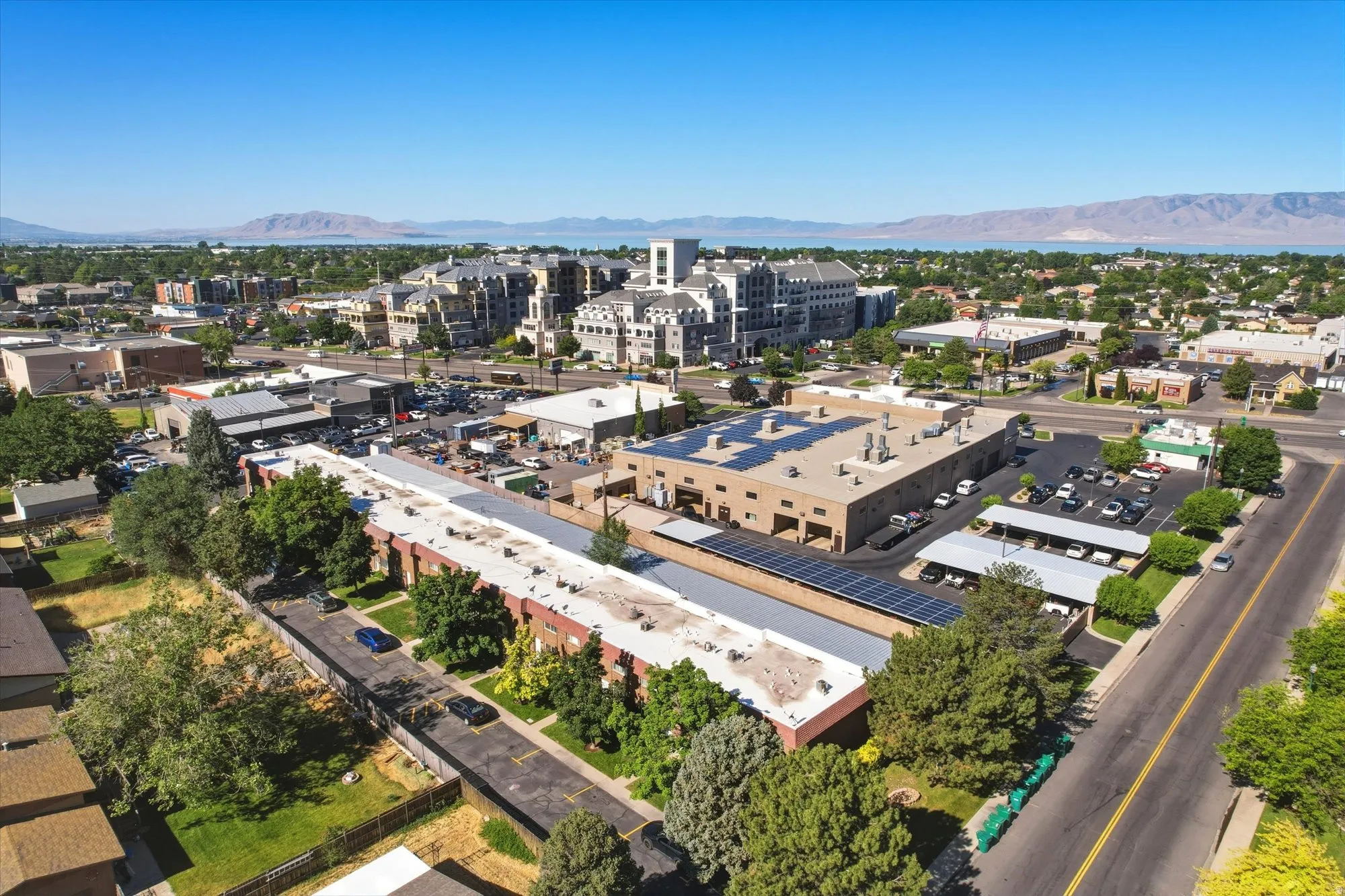 Aerial perspective showcasing multiple commercial structures with flat roofs and a street-facing orientation