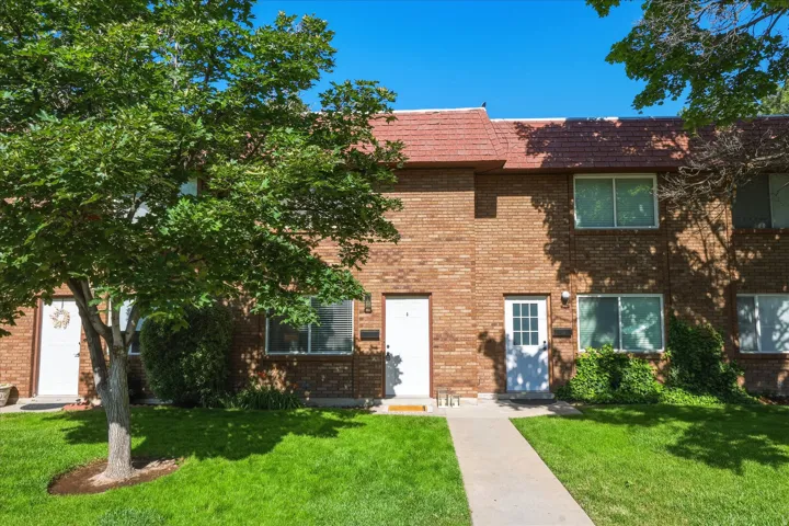 Brick exterior with red shingle roofing