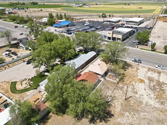 Aerial perspective showcasing multiple residential structures and commercial buildings