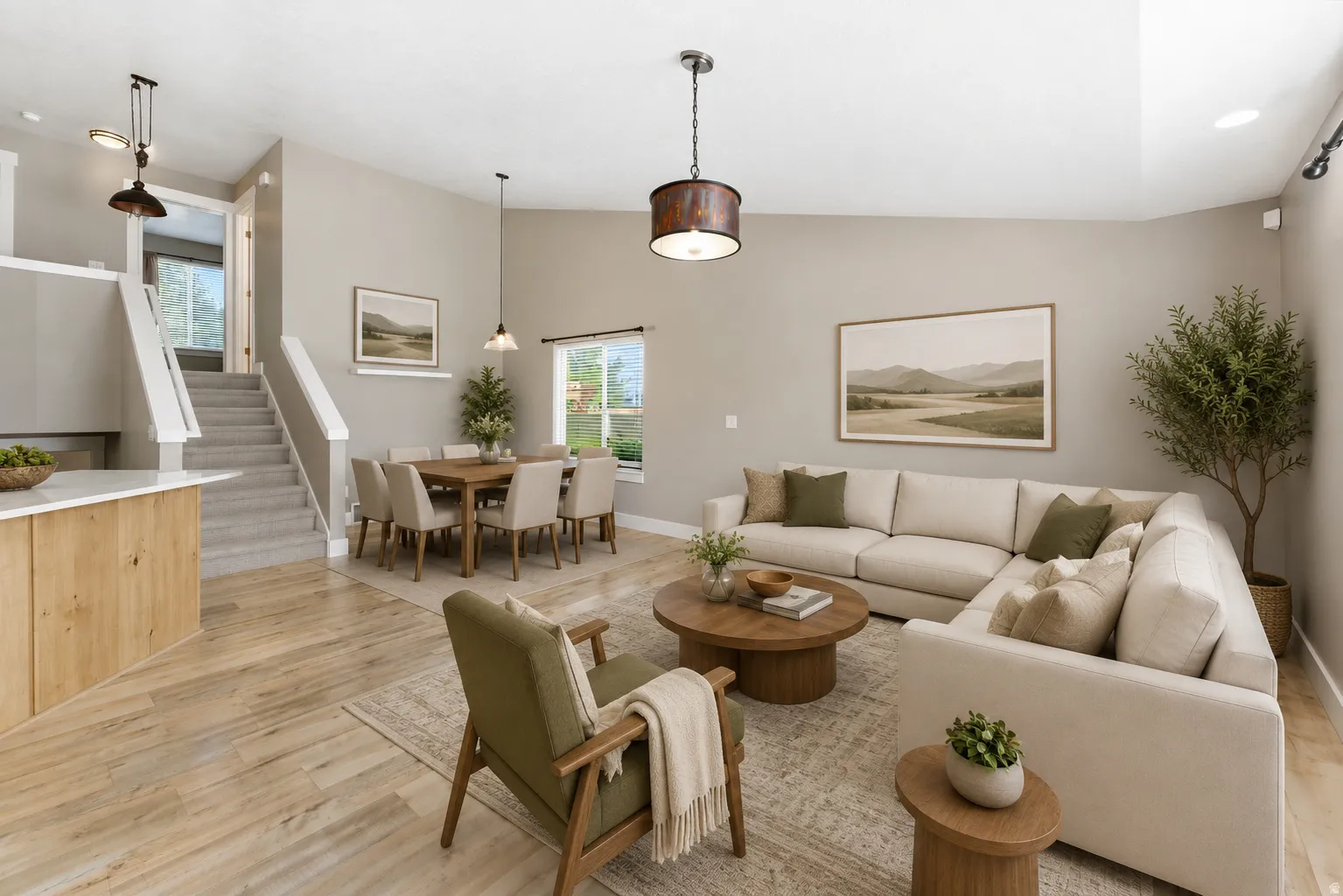 Virtually staged photo. Open-concept living and dining area featuring new LVP flooring, vaulted ceilings, and neutral wall tones