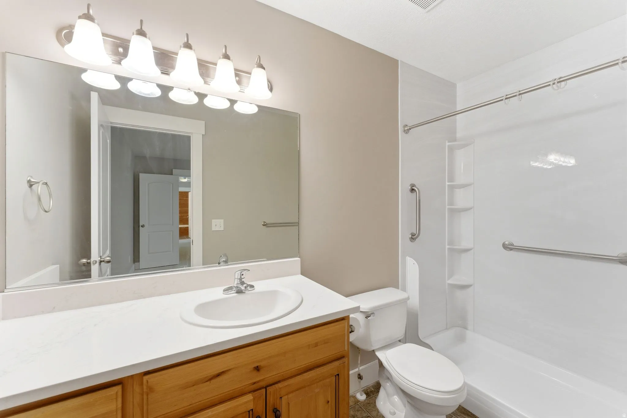 Primary Bathroom featuring a walk-in shower.