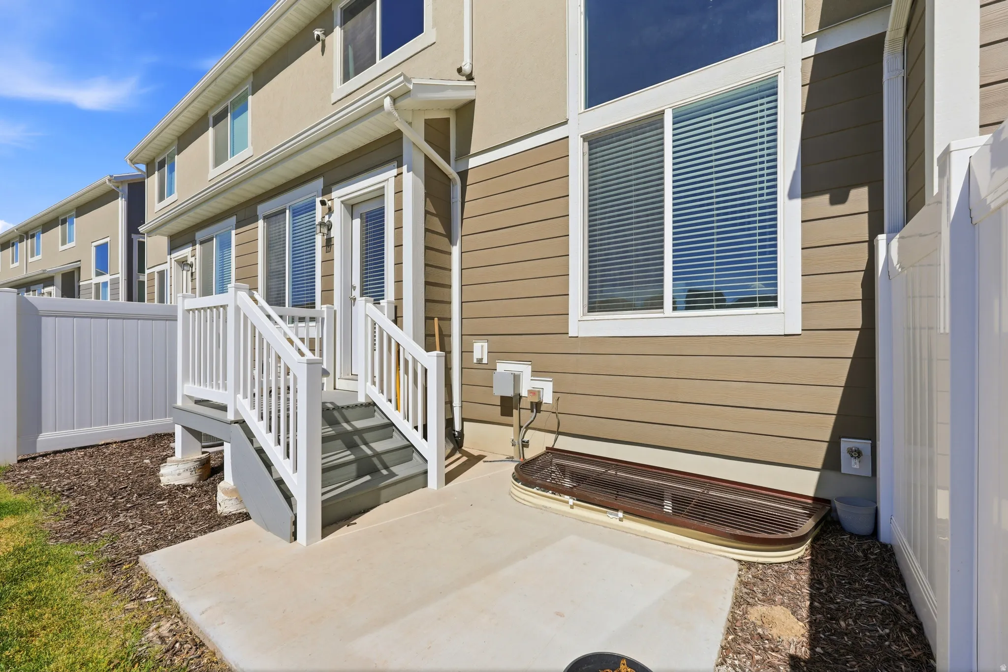 Rear exterior featuring horizontal siding and stucco finishes
