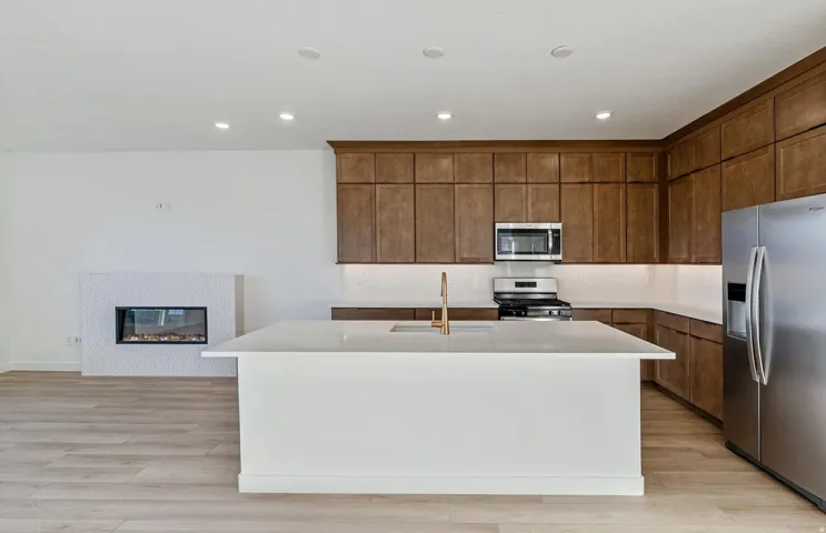 Open-concept living space with wood-finish flooring