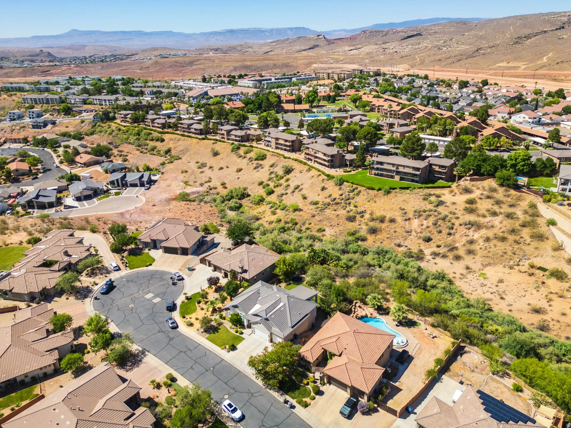 Residential properties with tile roofs and desert landscaping