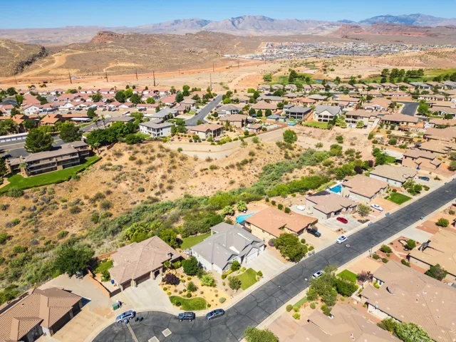 Residential neighborhood with varied rooflines and a mix of paved driveways and desert landscaping