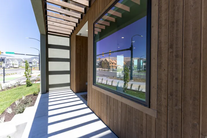 Contemporary exterior featuring vertical wood-finish siding and stucco accents