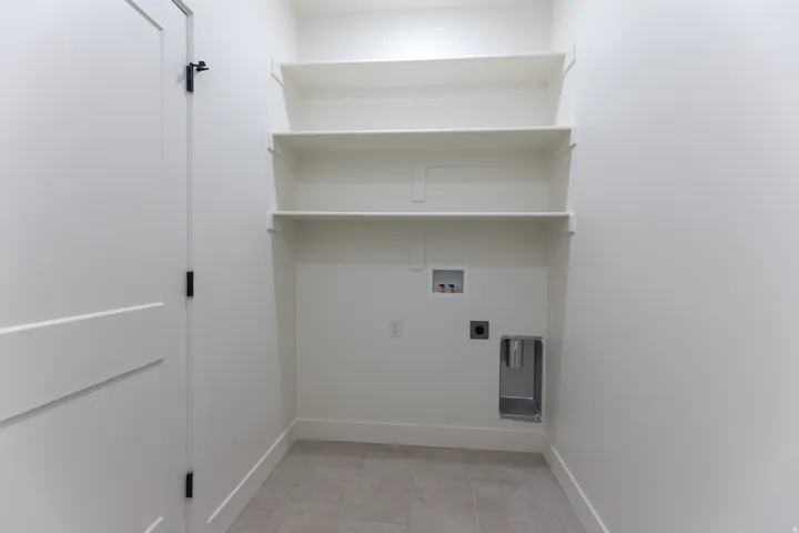 Laundry room with shelves