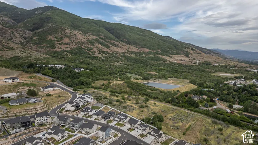 Aerial perspective highlighting a residential development with a mountainous backdrop
