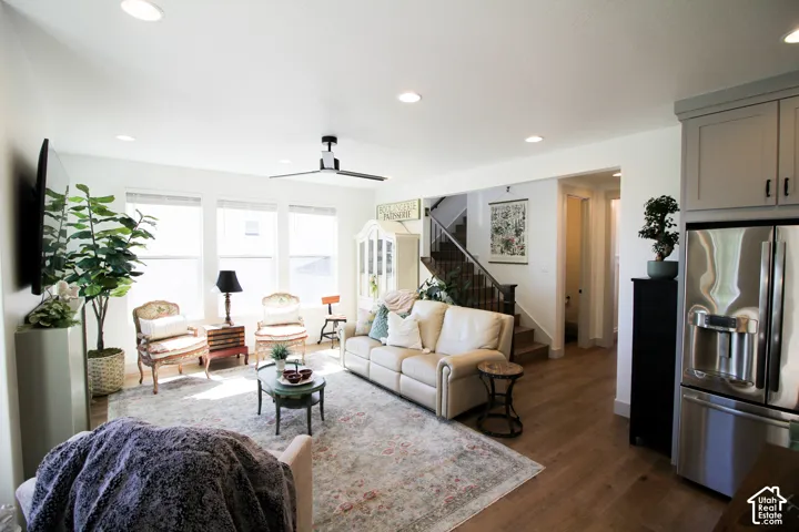 Open-concept living space with wood-finish flooring, recessed lighting, and a modern ceiling fan