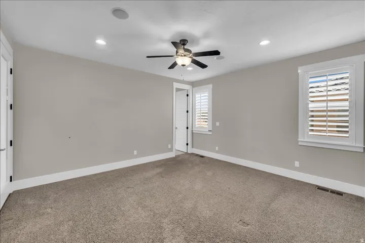 Carpeted room with neutral wall color