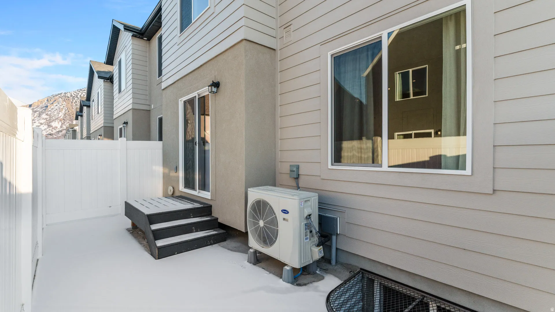 Exterior featuring horizontal siding and stucco accents