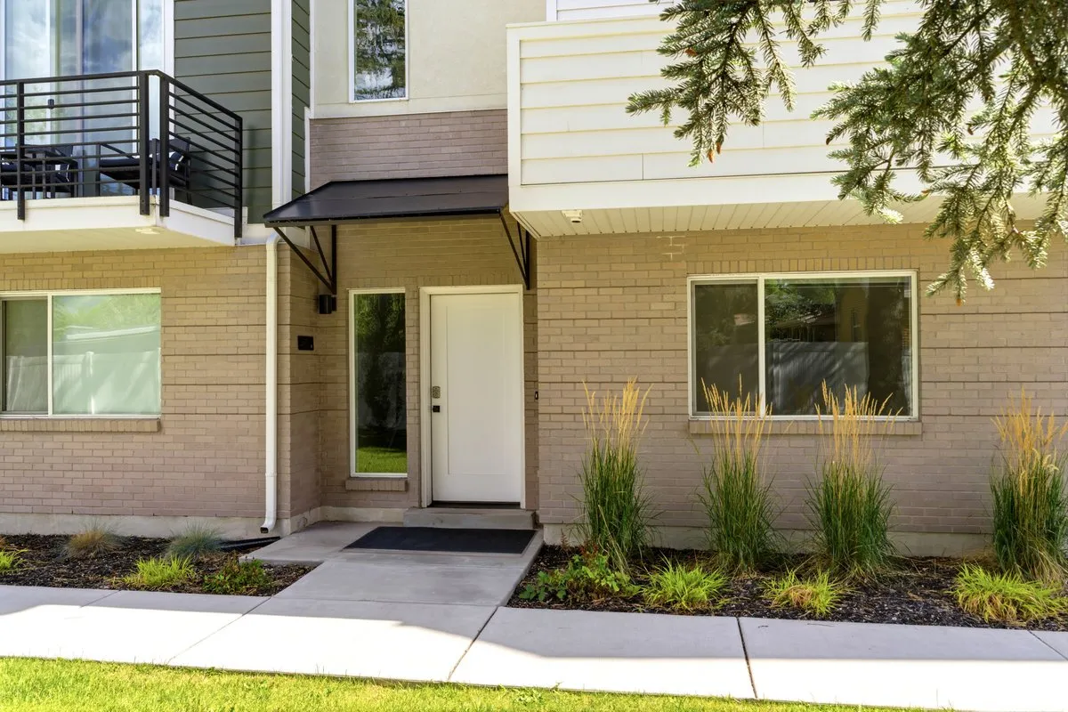 Modern exterior with light brick and horizontal siding accents