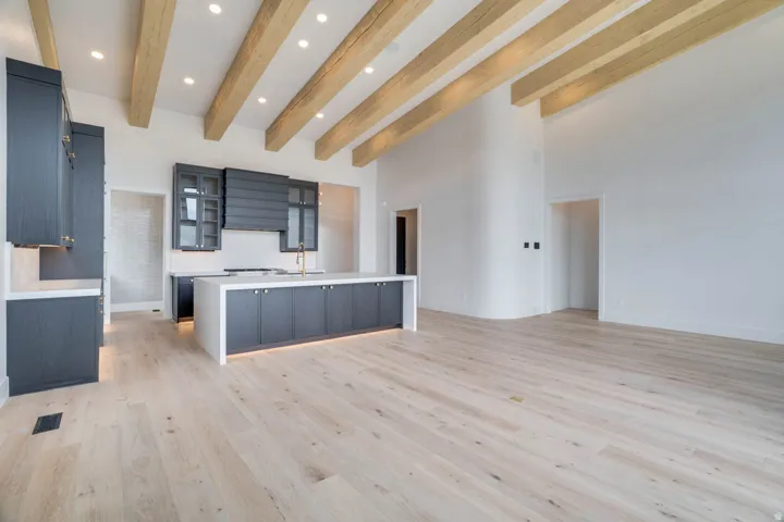 Kitchen island with integrated cabinetry and under-cabinet lighting