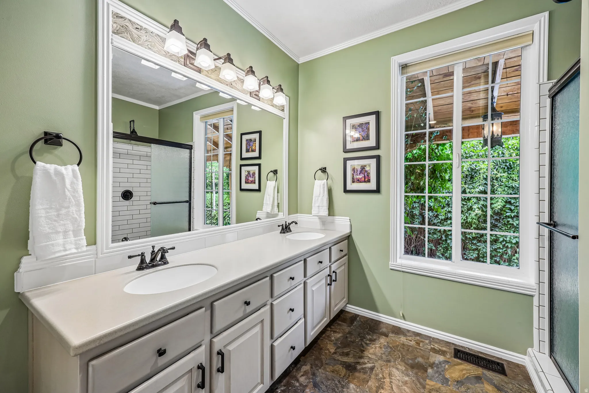 Dual vanity with undermount sinks and light-toned countertops