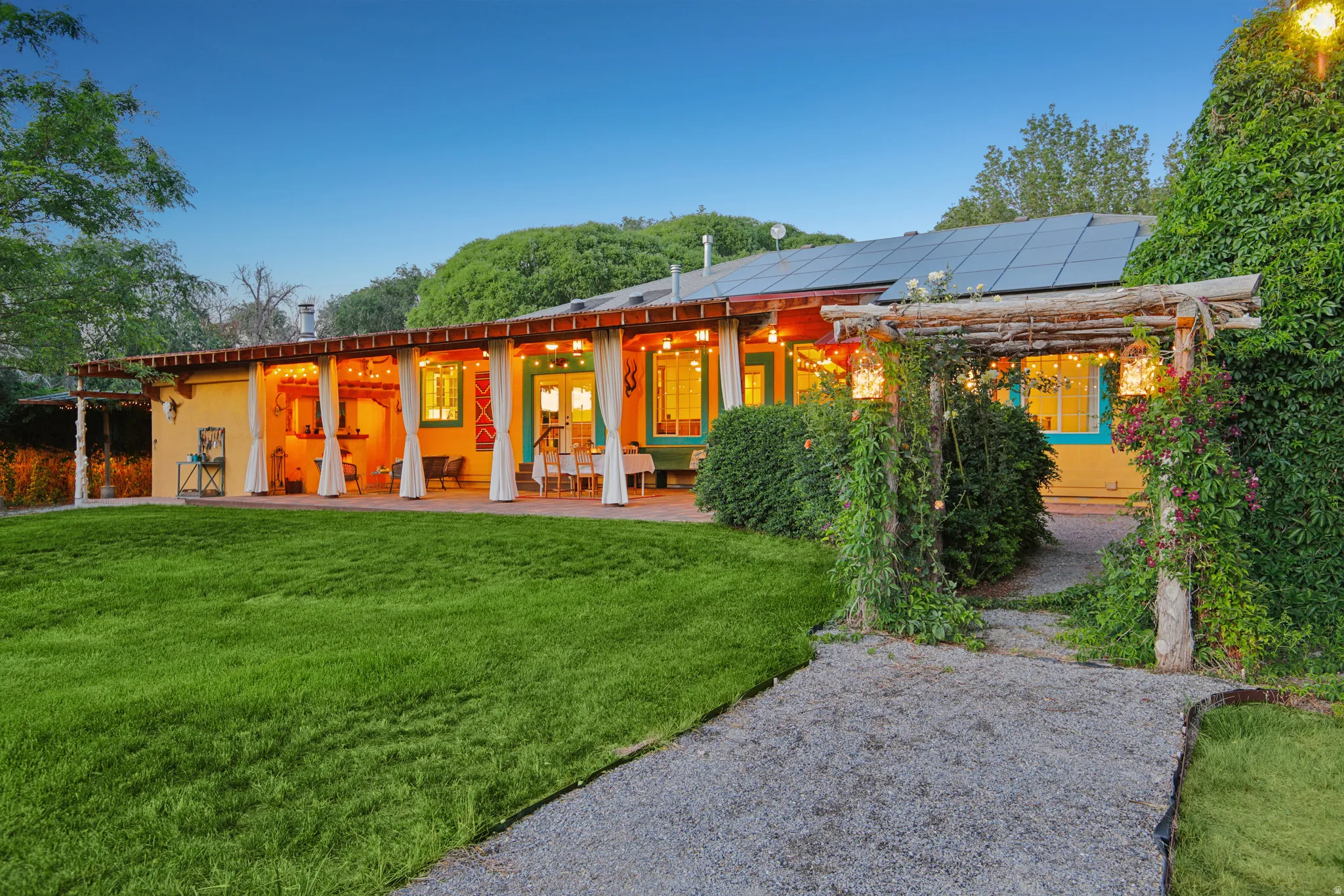 Expansive green lawn bordering a gravel pathway