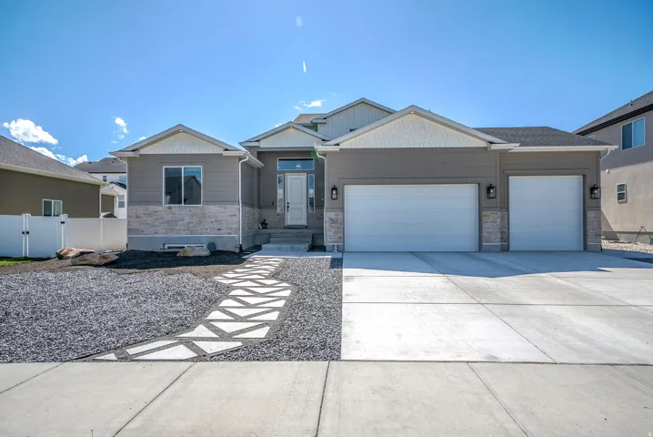 Contemporary exterior with a multi-gabled roofline and a two-car garage