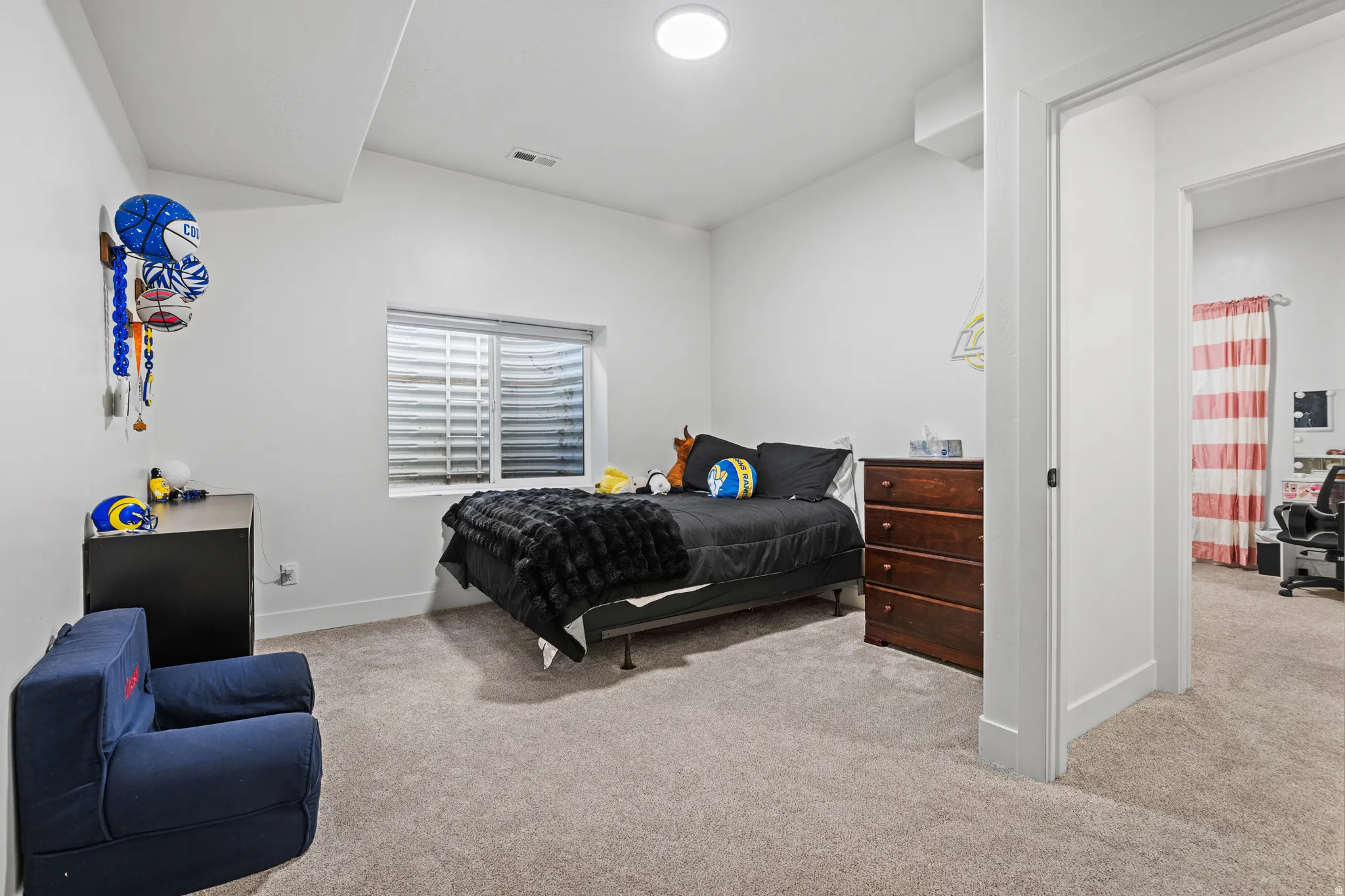 Room featuring neutral carpeting and white wall finishes