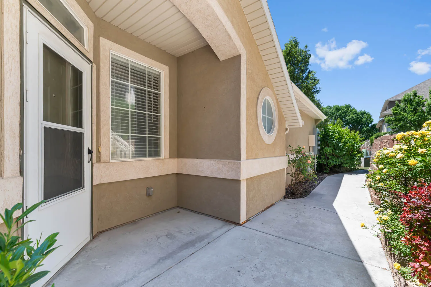 Exterior stucco siding with a contrasting trim band