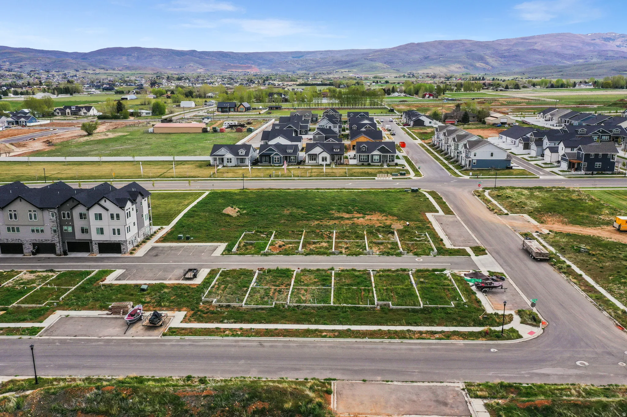 Aerial perspective showcasing a developing residential area with multiple building sites