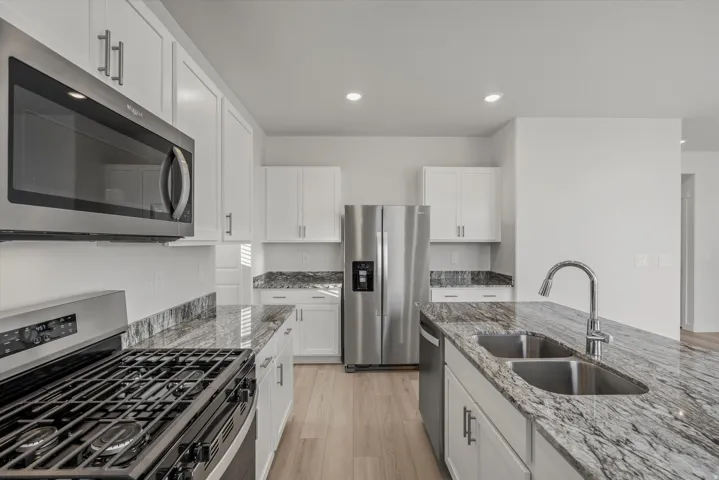 Kitchen featuring light wood-finish flooring and recessed lighting