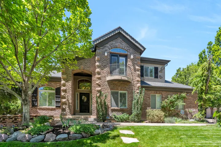 Stone and brick exterior with a prominent arched entry