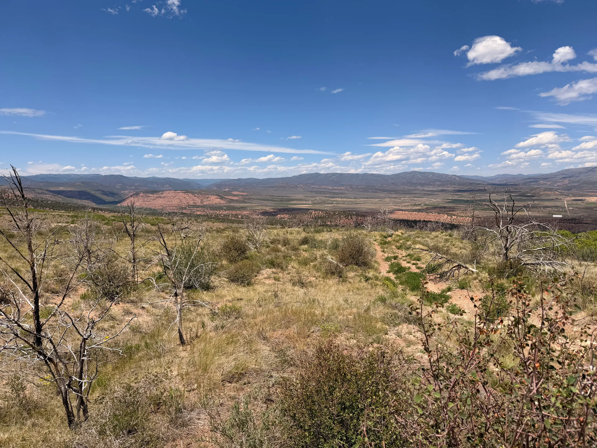 Stunning northern view, layered peaks, and iconic red rock undertones that define the local landscape.   Photo taken from middle of lot, looking North.