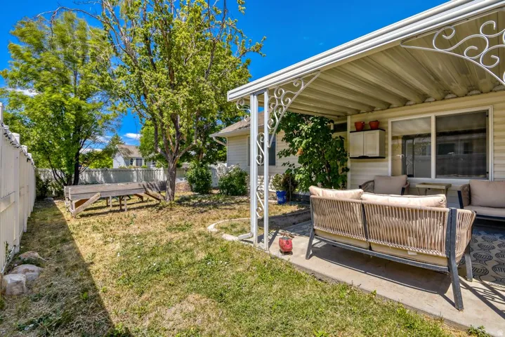 Covered patio featuring an ornamental metal awning