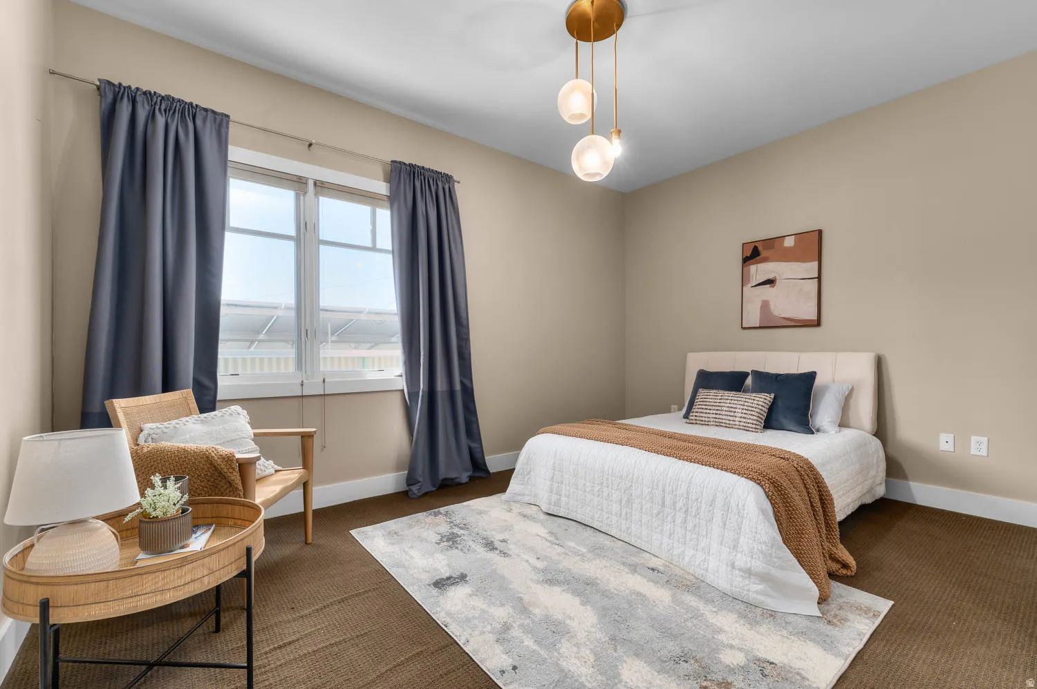 Room featuring a multi-pane window with dark curtains, a contemporary pendant light fixture, and neutral wall tones