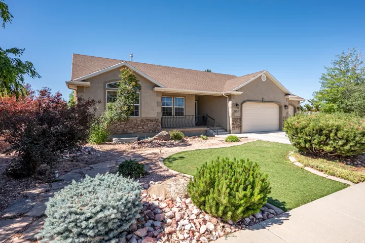 Stucco and stone exterior with arched window detailing