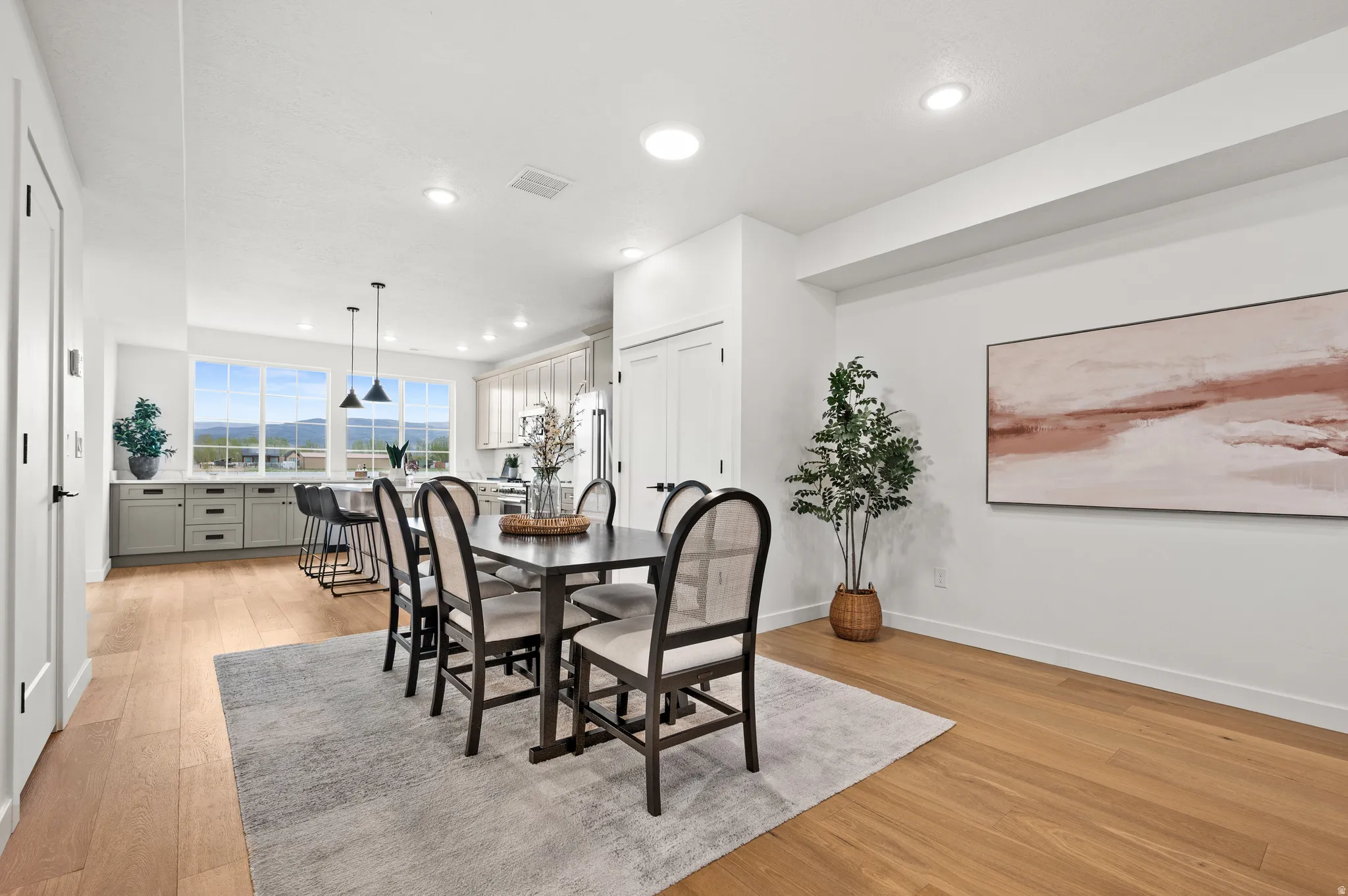 Open-concept living area featuring wood-finish flooring