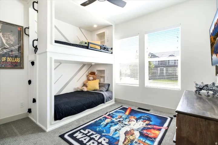 Custom built-in bunk beds with integrated climbing holds and shelving