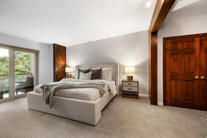 Hardwood-paneled accent wall and exposed beam detailing