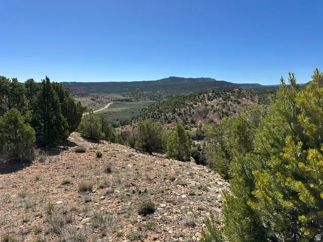 Expansive land parcel featuring natural terrain and sparse vegetation
