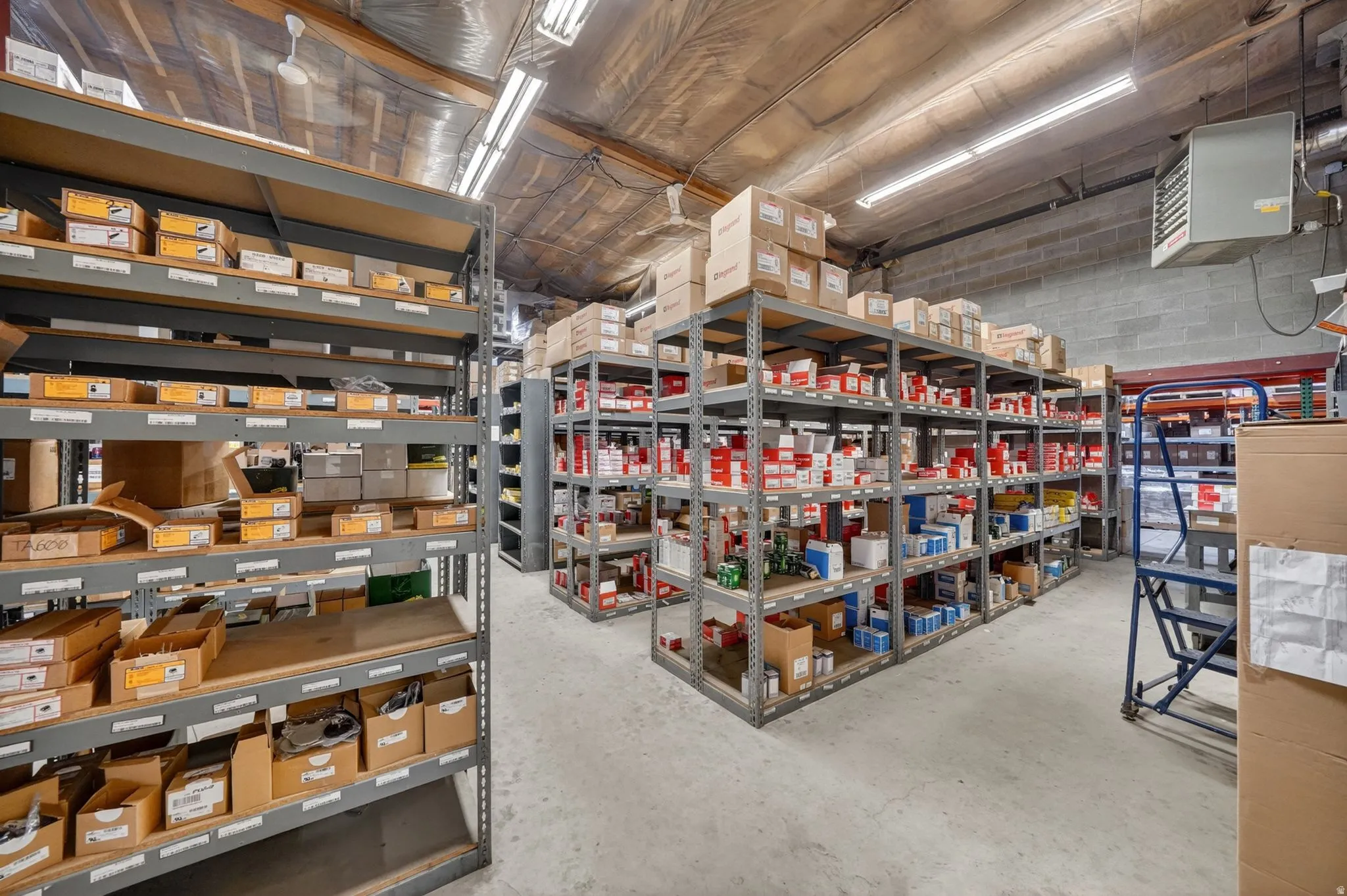 Spacious storage facility featuring multiple rows of industrial shelving units