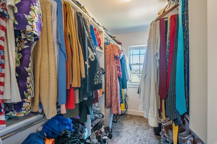 Walk-in closet in primary bedroom